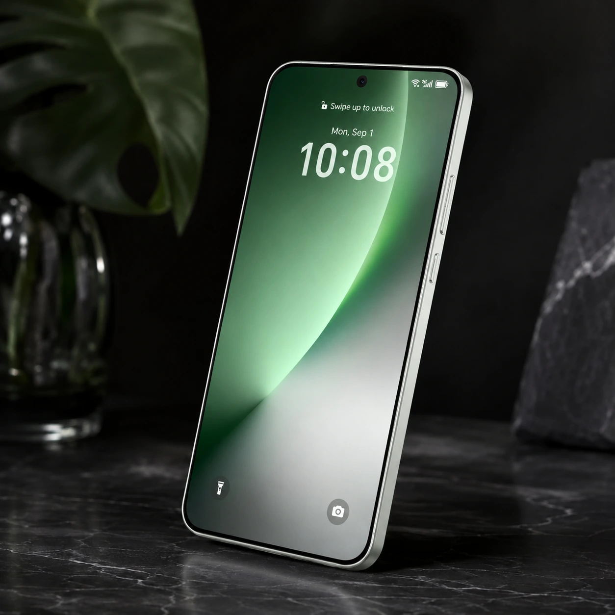 Smartphone Honor apoyado sobre una superficie de mármol negro mostrando su pantalla encendida con fondo verde